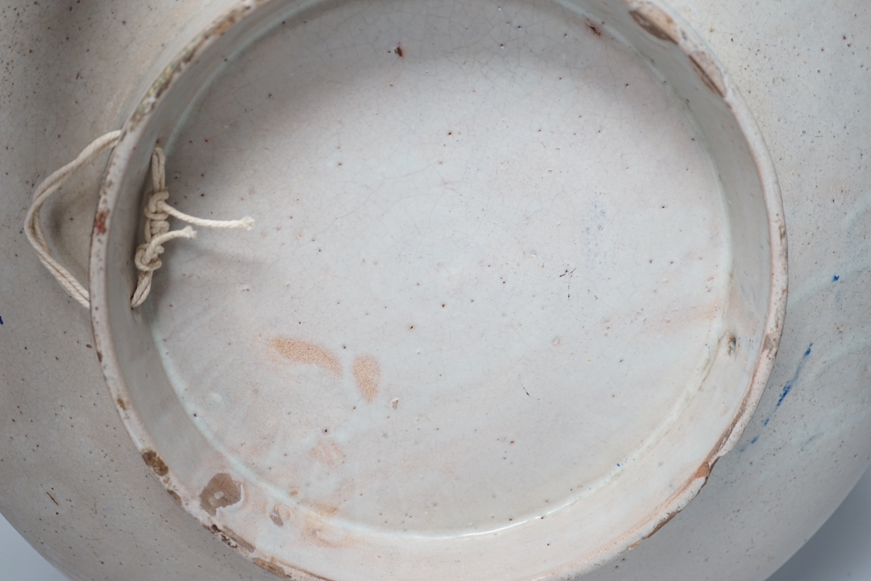 A large Moroccan pottery blue and white wall plate, 40cm diameter